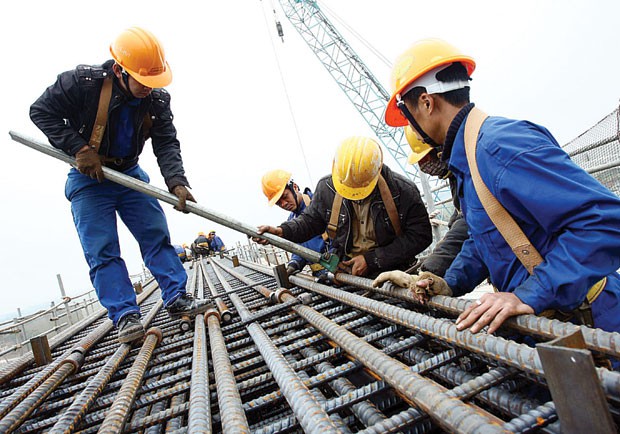 Do I have to apply for another construction permit when selling land that already has a construction permit in the name of the previous owner?